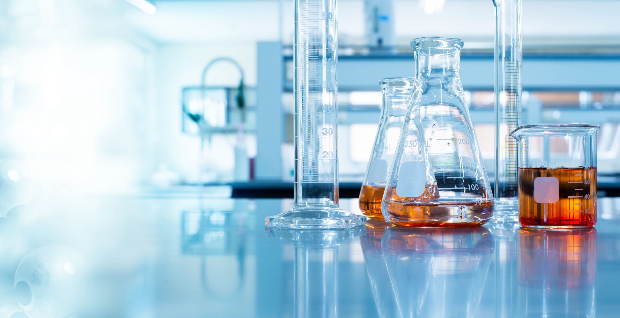 beaker and flask in science laboratory with chemical structure blue banner background